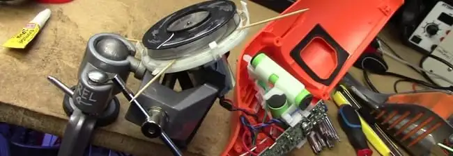 Vacuum cleaner repair parts and tools on a workbench in Dover, DE